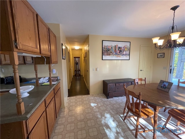 dining area featuring a chandelier