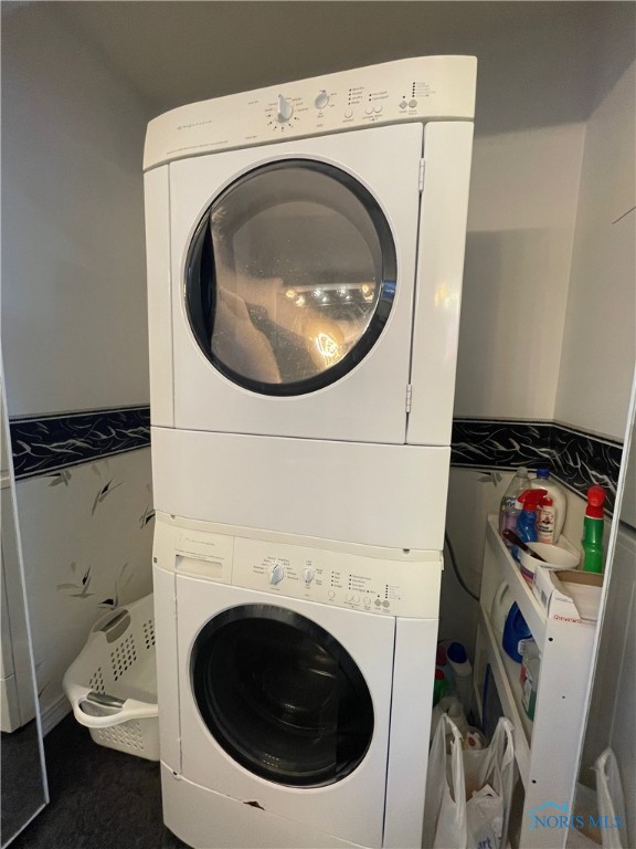 laundry room featuring stacked washer / dryer