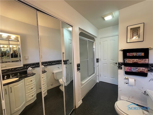 full bathroom featuring vanity, independent shower and bath, and toilet