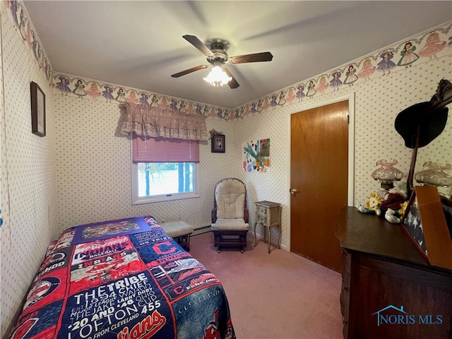 bedroom featuring carpet floors, baseboard heating, and ceiling fan