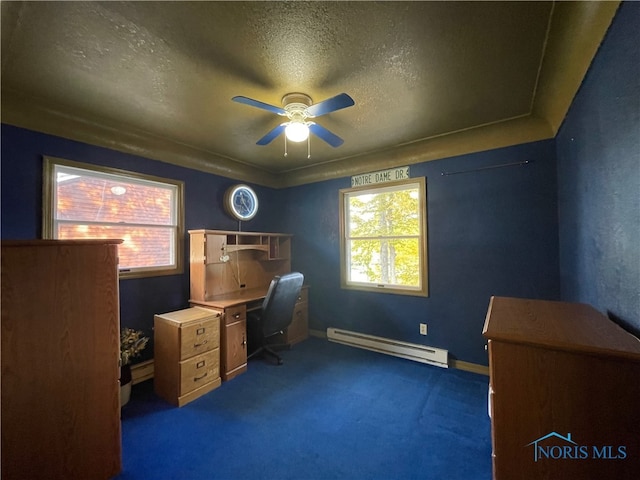 office space featuring a baseboard heating unit, a textured ceiling, dark carpet, and ceiling fan