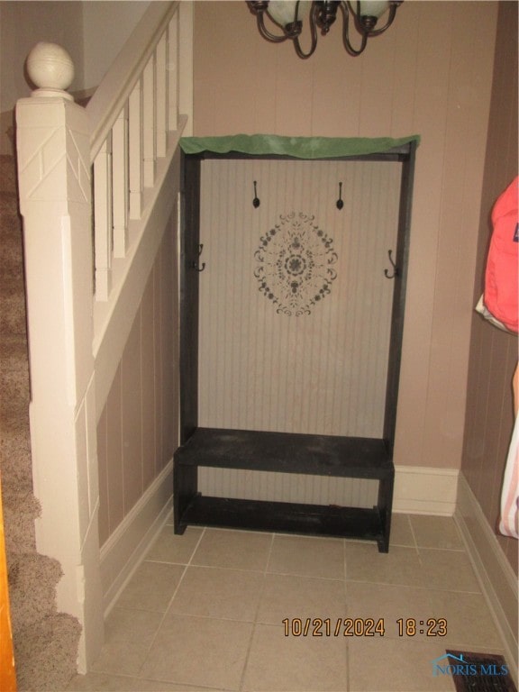 stairs featuring tile patterned floors