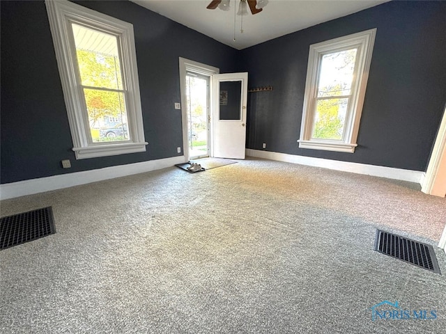 interior space with plenty of natural light and ceiling fan