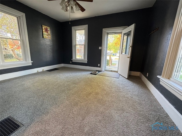 carpeted empty room with ceiling fan