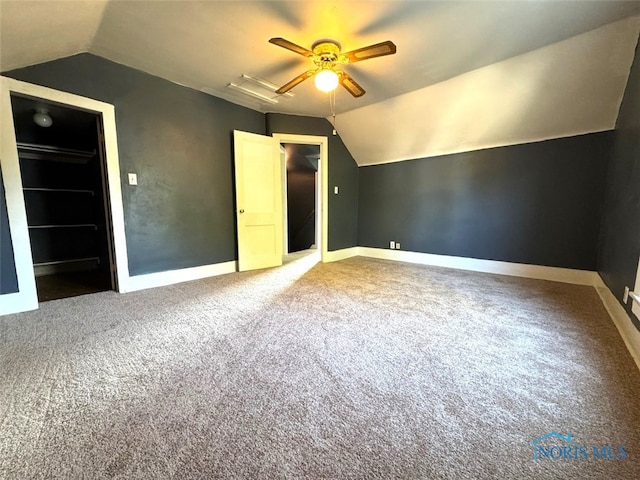 bonus room featuring ceiling fan, carpet flooring, and vaulted ceiling