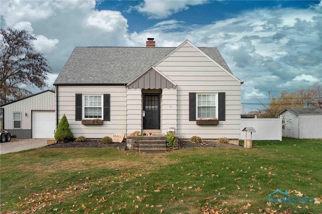 view of front of house featuring a garage and a front lawn