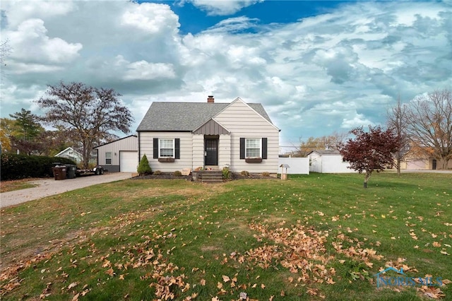 view of front of home featuring a garage and a front lawn