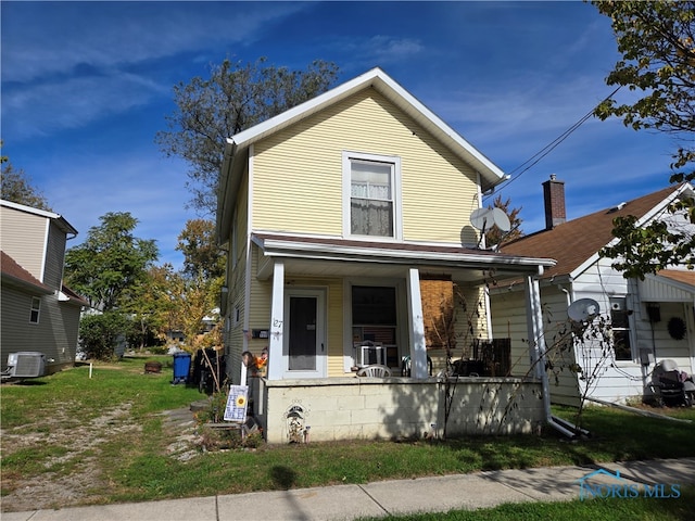 view of front of property with central AC and a porch