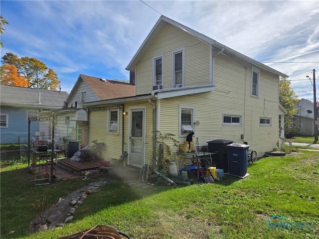 back of house with a yard