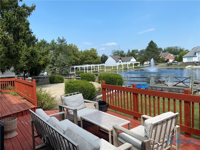 wooden deck featuring a water view