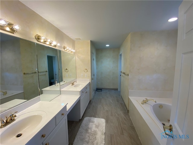 bathroom featuring vanity and a bathtub