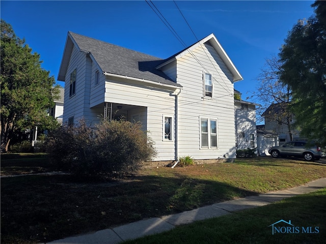 view of property exterior featuring a yard