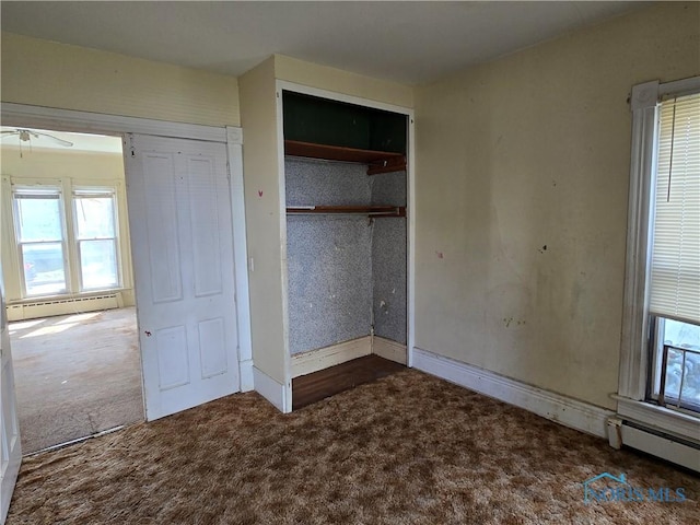 502 N Prospect St, Bowling Green, OH 43402 - unfurnished bedroom featuring carpet flooring, baseboard heating, a closet, and baseboards