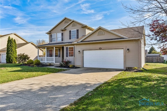 front facade featuring a front yard, a garage, and a porch