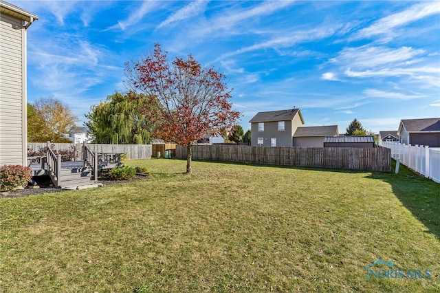 view of yard featuring a deck