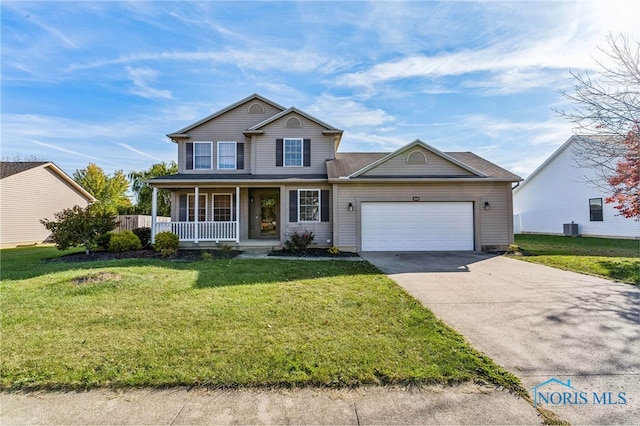 view of property featuring covered porch, central AC, a front lawn, and a garage