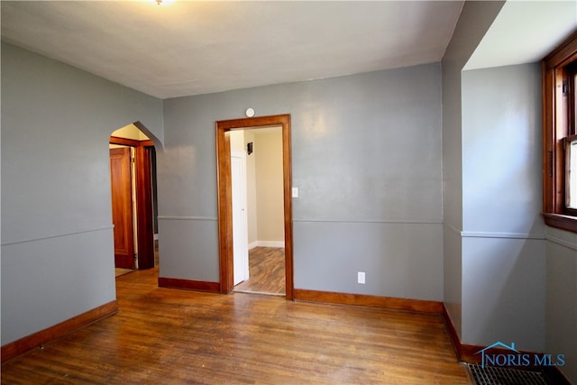 spare room featuring hardwood / wood-style flooring