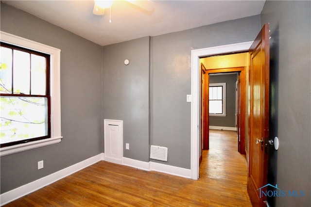 unfurnished room featuring ceiling fan and light hardwood / wood-style flooring