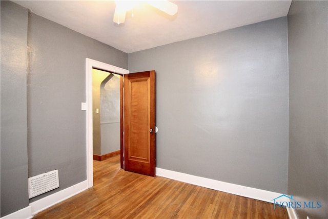 spare room with hardwood / wood-style flooring