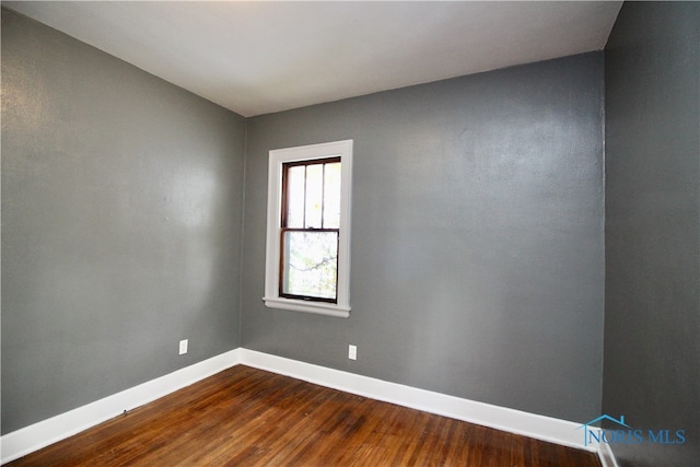 empty room featuring hardwood / wood-style floors