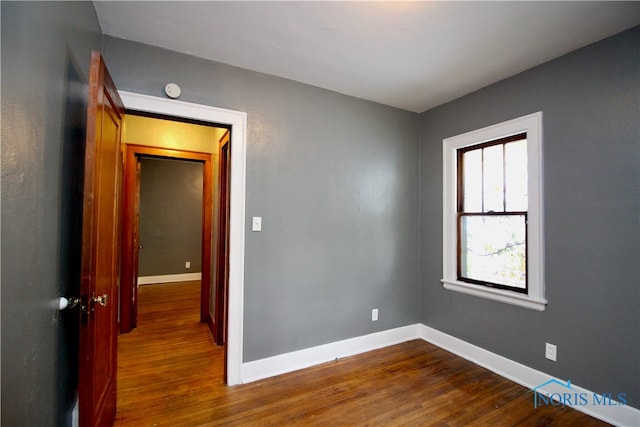 unfurnished room featuring wood-type flooring