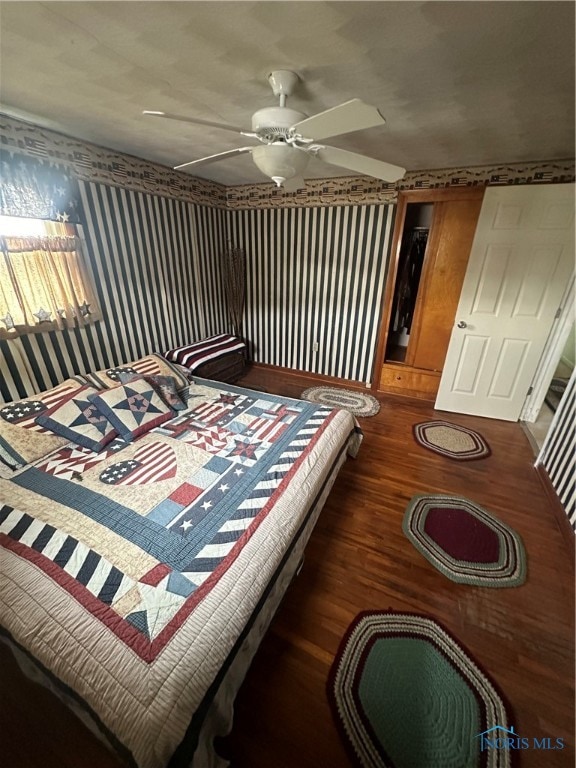 bedroom featuring dark wood-type flooring and ceiling fan