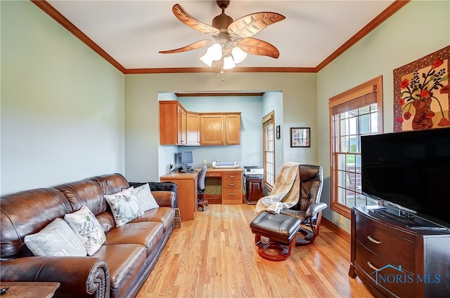 living room featuring crown molding, light hardwood / wood-style flooring, and ceiling fan