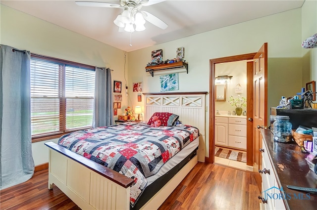 bedroom with ceiling fan, dark wood-type flooring, and connected bathroom