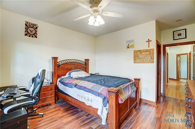 bedroom featuring wood-type flooring and ceiling fan