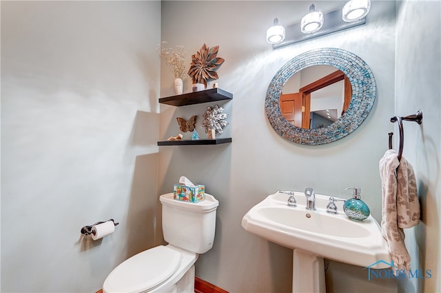 bathroom featuring toilet and sink