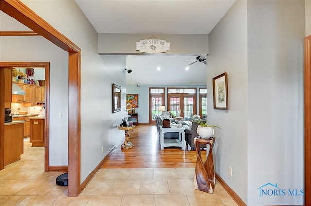 entryway featuring ceiling fan and light hardwood / wood-style flooring