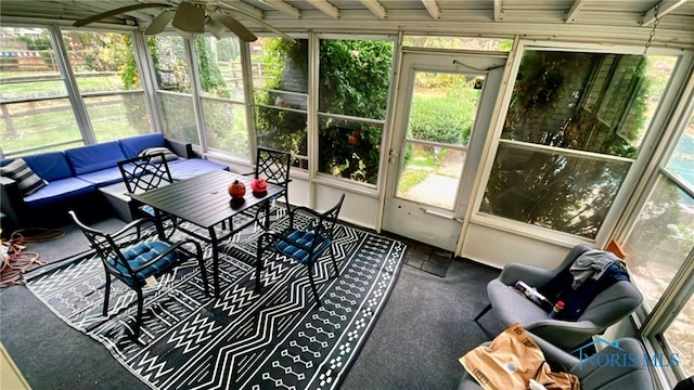 sunroom featuring ceiling fan