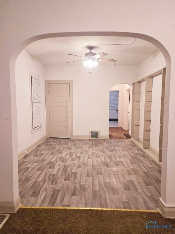 spare room featuring hardwood / wood-style flooring and ceiling fan