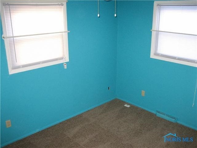 empty room featuring carpet flooring