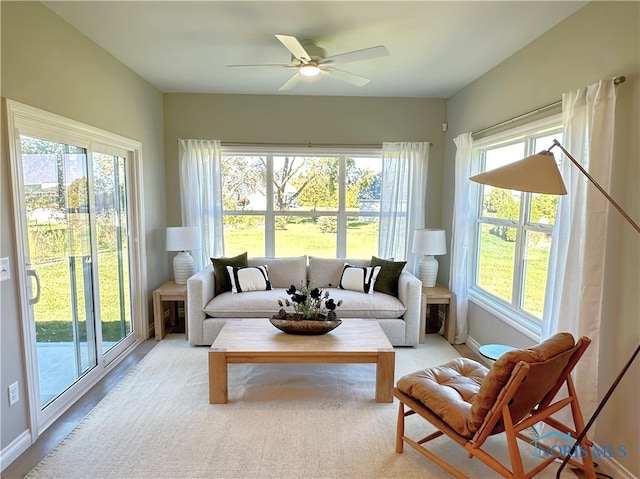 sunroom / solarium featuring ceiling fan and a healthy amount of sunlight