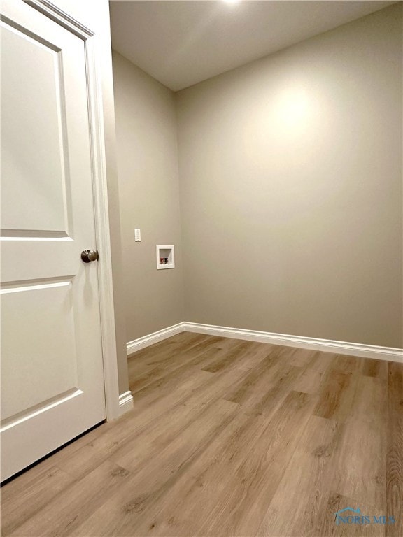 laundry area featuring hookup for a washing machine and light wood-type flooring