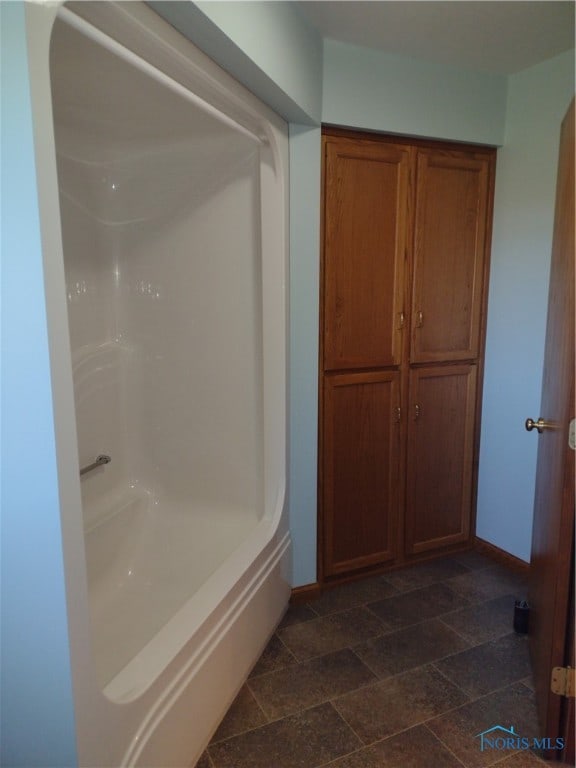 bathroom featuring washtub / shower combination