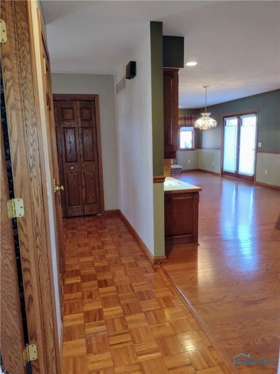 hallway with light parquet floors