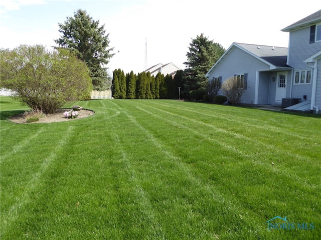 view of yard featuring central AC unit