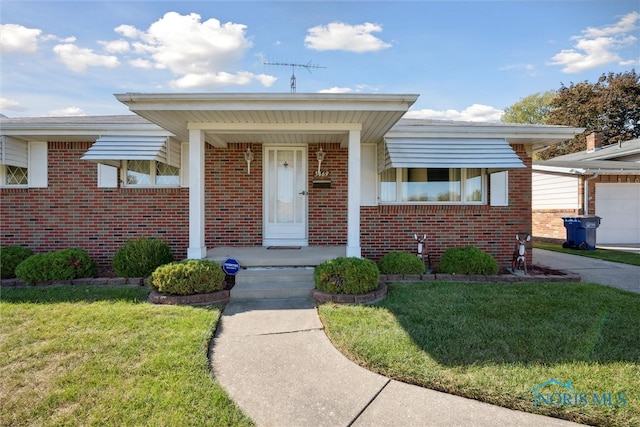 view of front of house with a front yard and a garage