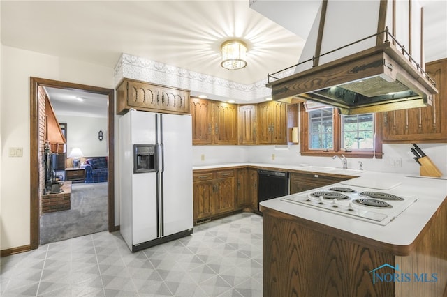 kitchen with light carpet, kitchen peninsula, island exhaust hood, sink, and white appliances