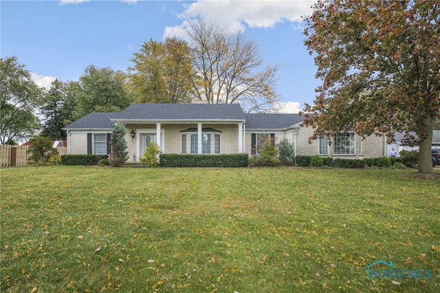 ranch-style house with a front lawn