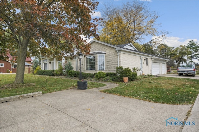 view of front facade with a front lawn and a garage