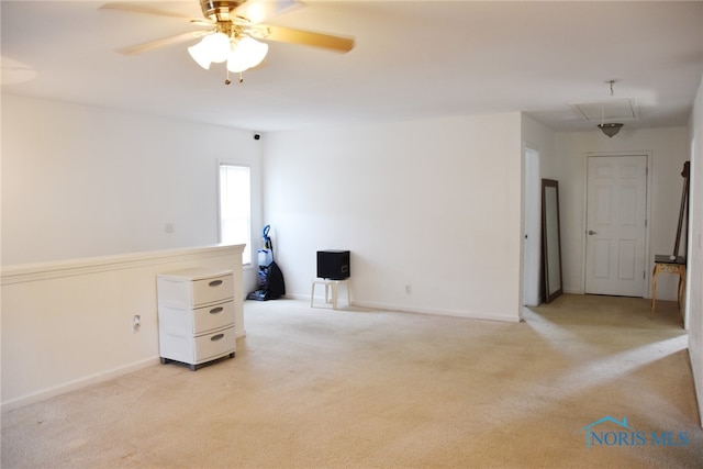 carpeted empty room featuring ceiling fan