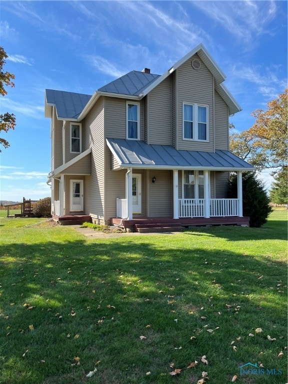 view of front of home featuring covered porch and a front lawn