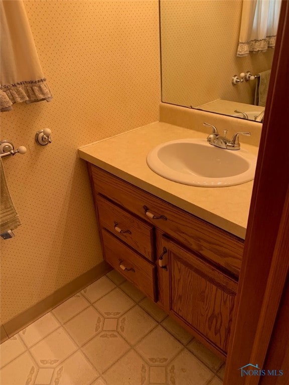 bathroom with vanity and tile patterned flooring