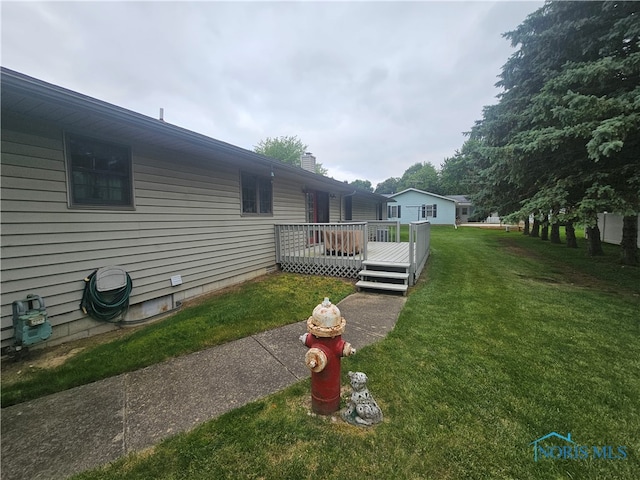 view of yard featuring a deck