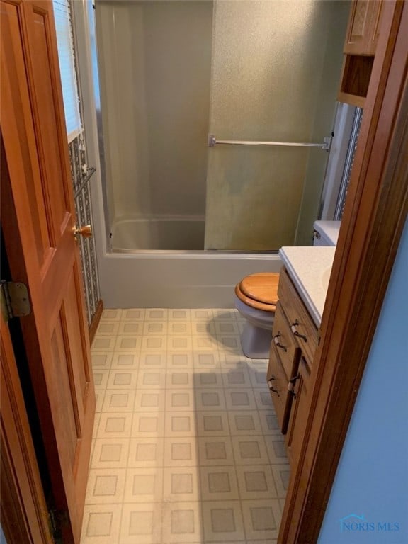 full bathroom featuring toilet, shower / washtub combination, and vanity