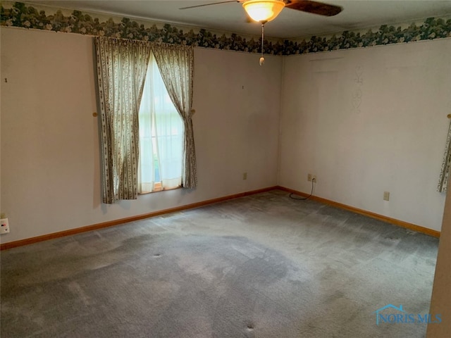 empty room featuring carpet and ceiling fan