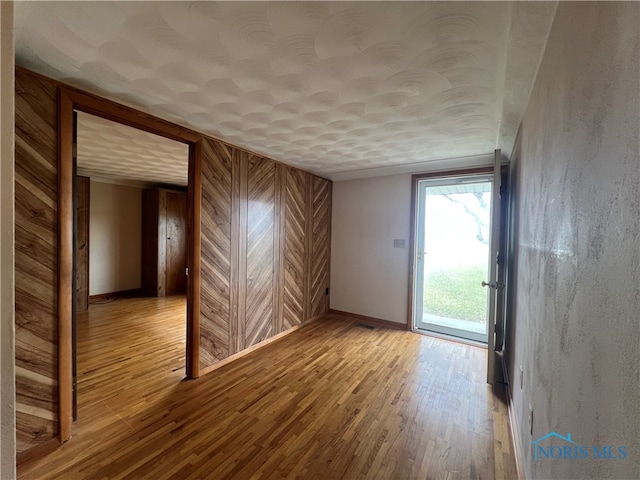 spare room featuring hardwood / wood-style flooring